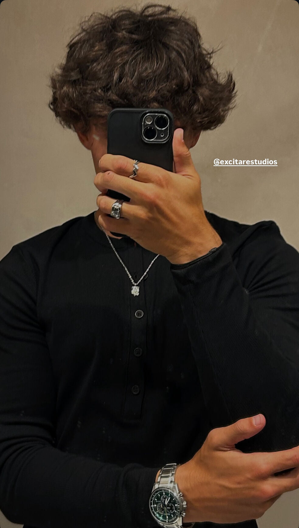 Customer wearing the Flower Ring and Ember Ring styled with a silver chain and watch, showcasing Excitàre Studios jewelry.